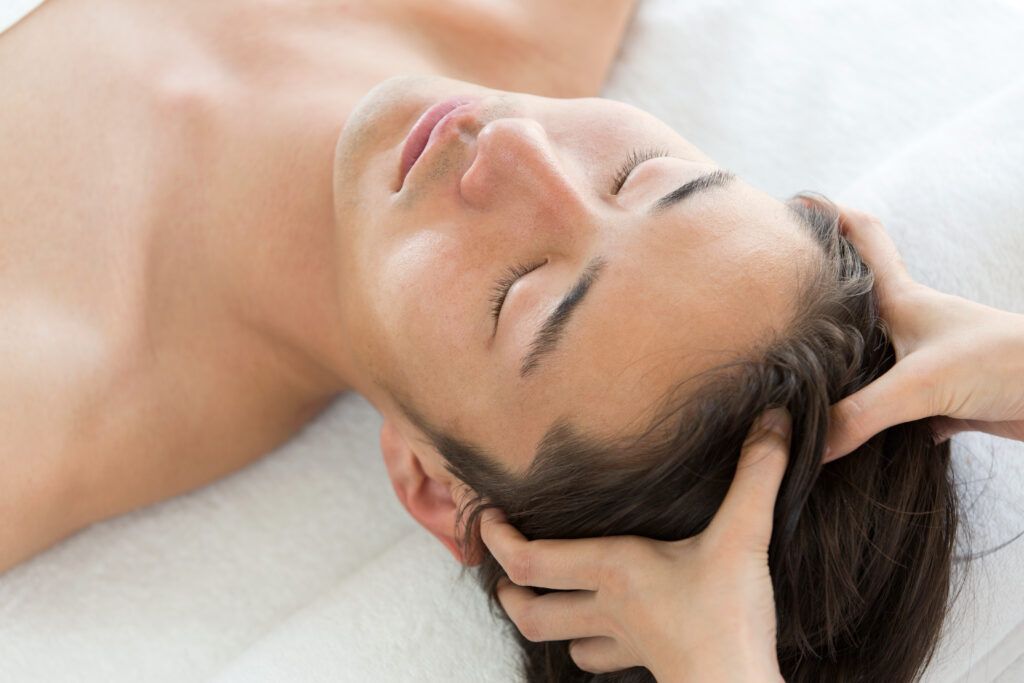 man getting scalp facial and massage